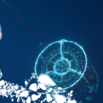 A ring of water bottles lowered through the icy waters captures water samples at varying depths