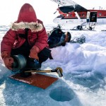 From holes drilled into the ice, the scientists collect samples of water from the sea below to learn about currents and chemistry. Here a researcher measures salinity and temperature.