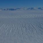 Fast moving glaciers develop crevasses, like stress fractures, that pull openings across the streaming ice